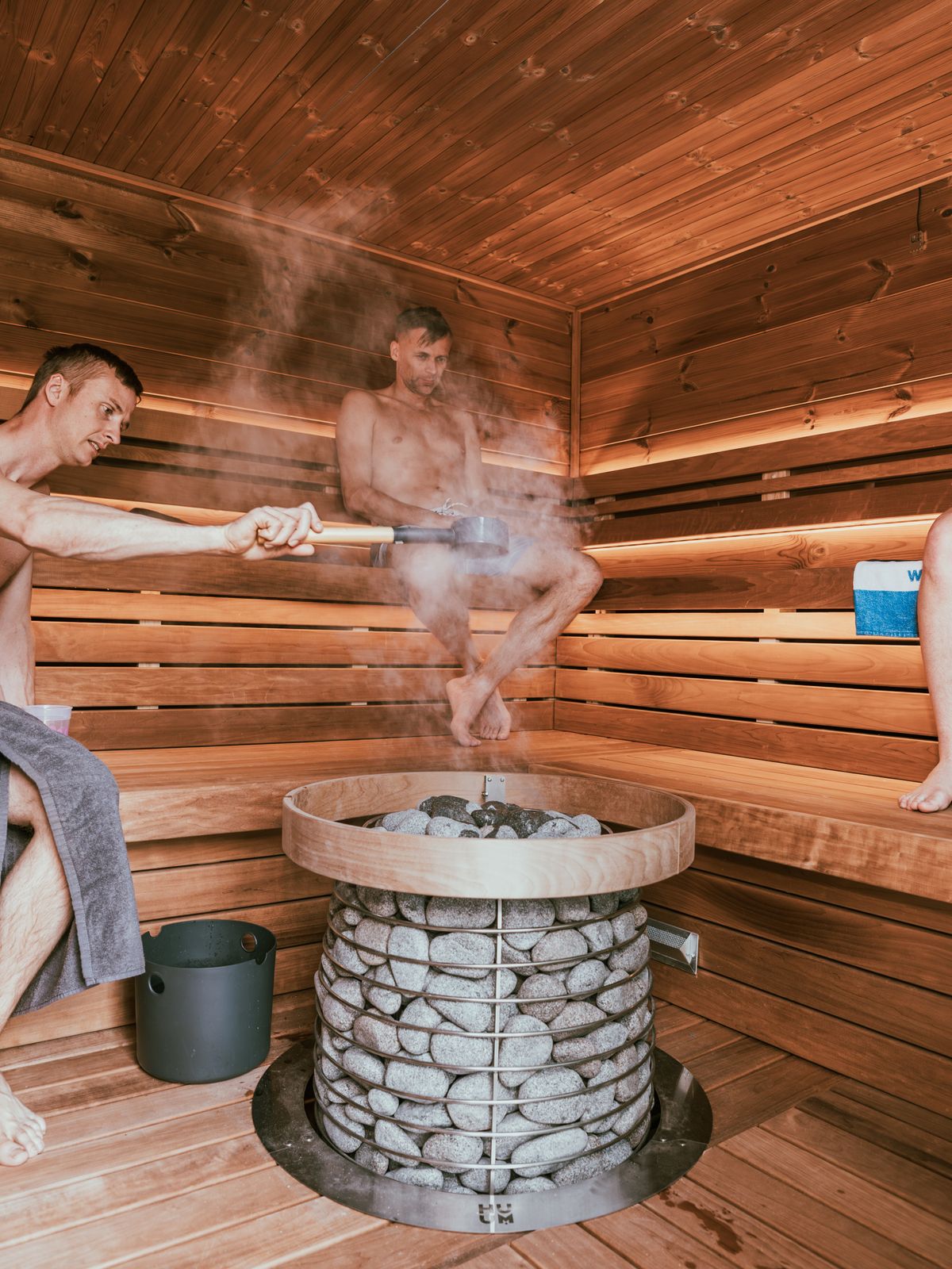 A few people sharing a warm sauna together